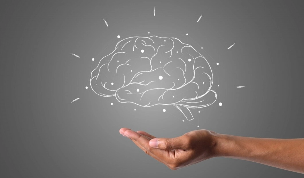 Brain in hand brain drow using white chalk improve mental health